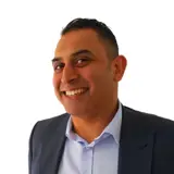 Binz in a suit with no background and no tie, Aaron Wallis Sales Recruitment