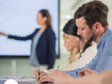 Photo of a candidate presenting to a second interview panel